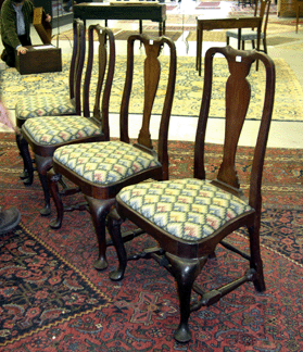 The set of four Massachusetts Queen Anne mahogany side chairs had balloon seats and vasiform backs on interesting stepped shoes and sold for 55680