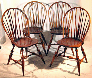 This set of four 301 Windsor brace back side chairs with New England turnings and assorted Nutting markings sold for 3850