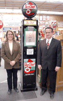 Auctioneers Keith and Delores Meissner with the Sky Chief gas pump that had been restored to likenew condition It sold for 1870