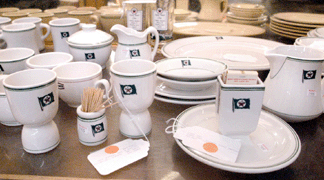 A large collection of Texaco dinner service items was divided up into ten lots and sold for a cumulative price of 1190 Individually lots sold for 286 for a pair of creamers 247 for two egg cups 192 for seven coffee cups and 77 for a match holder