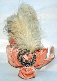 The crescent pin hair ornament from the 1920s is embellished with rhinestones and aigrettes long delicate feathers from the egret This may have been worn with a bandeau or headband either focused in the center of the forehead or on one side