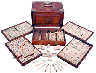 Mah Jongg game set China 1923 The teakwood box contains four drawers filled with bamboo and ivory game pieces A popular Chinese game in the early Twentieth Century Mah Jongg was discovered by the Western world in the 1920s and rapidly became a fad It is a tile game somewhat like the card game Rummy but with complex scoring and accompanying rituals