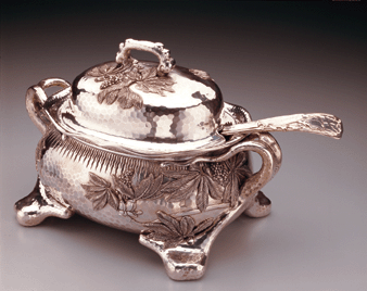 The elegant silver gilt covered soup tureen and ladle were made by Tiffany in 1881
