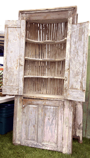 A rare item was this early Eighteenth Century barrel back corner cupboard taken from the oldest house in Hollis NH A truly unusual piece it had shaped shelves and picture frame molding and rose head nails Mays Antiques Market
