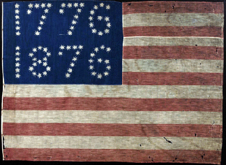 A 38star centennial celebration flag was printed on a wool and cotton fabric around 1876 A thin line between the points of each star makes the stars really pop Thirtyeight stars signifying the number of states in the Union create the legend 1776 The maker of the flag needed 43 stars to create 1876