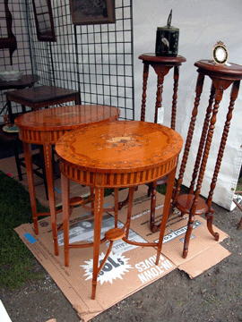 This pair of Edwardian satinwood drum tables with mahogany inlay was being offered by Eric Stang of Portland Maine