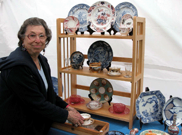 Iris Oseas of Van Deusen House Hurley NY sets up her display of English and Continental porcelain She and her husband Jonathan who specializes in antique tools have been dealers at the show for more than 40 years