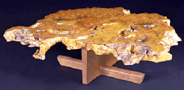 An exceptional George Nakashima Minguren I buckeye burl and walnut coffee table made in 1981 sold for 102000