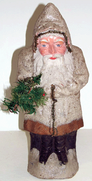 A German Belsnickle composition Santa circa 1890 hollow candy container with painted and molded features was a nice buy at 2860