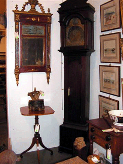 New Jersey Americana at its best The rare American mahogany tall case clock shown in this photo was made by Lebbeus Dod Mendham NJ 17391816 It sold to a floor bidder for 14950 The Italian neoclassical faux painted and parcel gilt mirror on the wall next to the clock brought 1955 and the American tiger maple tripod table realized 1150