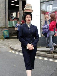 A deportment race by the Librarians a performance group makes it way through the streets of HayOnWye