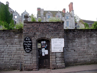 Caught early in the morning before the streets were flooded with people this Twelfth Century castle appears comfortable in its repose Signs indicate activity to come