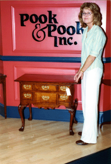 Patron Doris Henry stands beside the Philadelphia Queen Anne tiger maple dressing table circa 1750 one long drawer over three short drawers By family tradition it was purchased from the estate of Charles Thompson secretary to the Continental Congress and sold at auction for 35000