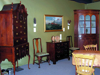 Americana at its best in the form of this circa 1775 Chippendale bonnet top highboy far left awaited patrons in the booth of Heller Washam Antiques Woodbury Conn Hailing from the Glastonbury area of Connecticut this cherrywood gem was offered for 195000