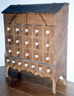 Seed chest in the collection of the great-grandson of the maker, John Palm Boyer. It is of nailed construction and has a desk-lid top and a drawer arrangement of five over five over five over seven. Height, 22 ½ inches. Private collection.