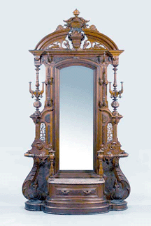 A monumental American Renaissance Revival walnut and burl walnut hall tree, third quarter Nineteenth Century, sold for $24,000.