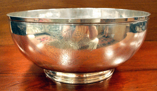 The George II silver footed punch bowl by Joe Hamilton, Dublin, was bid to $97,750.