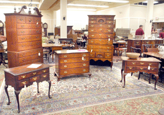Americana did well with the Queen Anne walnut dressing table attributed to Philadelphia maker William Savery, left, selling at $45,150. The other dressing table attributed to Savery brought $21,275, the Chippendale blocked serpentine front four-drawer chest thought to have been made in the Hartford, Conn., region realized $18,400 and the Chippendale chest-on-chest with pierce carved bonnet top and carved center finial, attributed to the Chapin school, sold at $11,500.