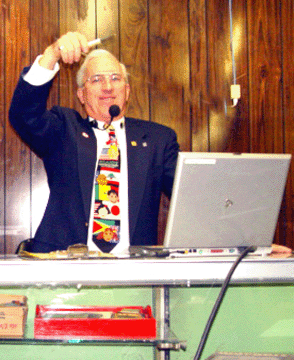 Auctioneer Don Traver, shown working an auction earlier this year, banged his gavel down for the last time at the Absolute Auction Center.