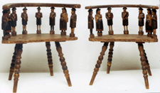 A pair of Moravian wedding chairs found in Pennsylvania with carved figures representing family members brought 6500