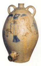 A stoneware cooler with eagle decoration brought 29700