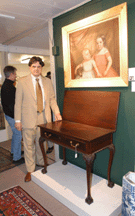 Auctioneer Kaja Veilleux with the table he described as having a significant singlefamily history