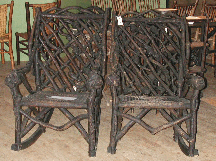 A bid of 4000 took this pair of burl and root Southern rockers circa 1930 with mosaic seats