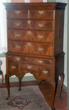 Passed down in the Rufus Merriam family the piece was made of walnut and featured burl fronts on its drawers and the original brasses