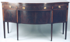 As the top lot this Hepplewhite inlaid sideboard sold for 50600