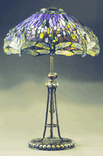 Dragonfly lamp with deep blue glass shade and bronze pierced base and finial by Tiffany Studios