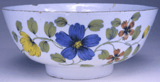 Punchbowl Liverpool England circa 1759 Tinglazed earthenware with polychrome flowers and Success to genl Wolfe in well