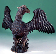 A delightful collection of carved wooden eagles owls roosters lions and tigers are featured in Schimmel and Mountz Two Pennsylvania Carvers including this spread winged eagle by Germanborn William Schimmel