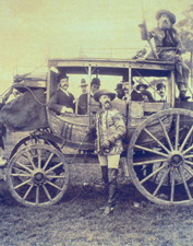 Buffalo Bill Standing by Wild West Stagecoach circa 1891 Photograph from the collection of Michael and Pat Del Castello on view at the Bruce Museum