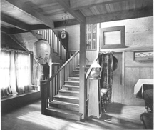 When in residence at Byrdcliffe the Whiteheads lived at their Arts and Crafts home White Pines which they had built in 1903 This period photograph of the front hall and staircase illustrates their love of handcraftsmanship and natural forms