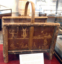 Around 1880 Joseph Tomah of the Passamaquody created this log carrier with narrative scenes etched in birchbark