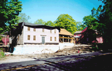 The SloanRaymondFitch House sits roofless high on its new foundation