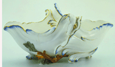 This sculptural sauceboat of softpaste porcelain from the Sevres factory 1756 masks its function as a wave surging over a bit of coral and seaweed