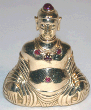 Buddha purse flacon by Van Cleef United States 1940s Gold cabochon rubies Lent by Ken Leach