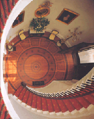 The Millford staircase from the second floor landing The circular trompe loeil painted floor is by Robert Jackson