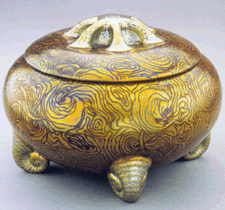 Zsolnay reached the apogee of its success with Art Nouveau pieces made during the early Twentieth Century winning top prizes in Paris St Louis Milan and London This lidded container with snailshaped feet 191213 is decorated with the shimmering eosin glazes designed to compete with contemporary French luster ceramics and American Tiffany glass
