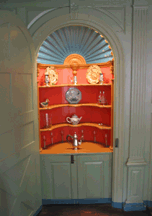 A builtin china closet called a beaufat was used to showcase the households prize possessions in the best parlor