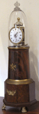 The star of the show incorporates all the best features a porcelain dial highly figured mahogany veneer and ormolu mounts including rim ring feet and two houses