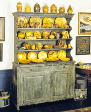 Open cupboard or dresser artist unidentified circa 175080 Probably Lancaster Lancaster County Penn paint on pine and poplar with iron hardware Traditional German woodworking techniques are seen in the construction and design of this piece