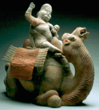 Earthenware figural group of a western Asiatic woman suckling a baby Tang period 41 cm high