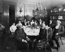 Golden wedding anniversary dinner for Mr and Mrs Joseph Guttenberg in their dining room 118 West 120th Street 1902 note mantelpiece in right background MCNY Byron Collection