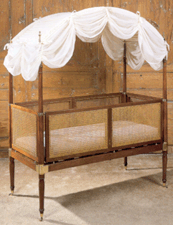 A childs cabin bed of mahogany brass caning and cotton manufactured by Morgan amp Sanders circa 181015 could be broken down