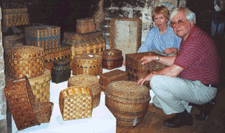 Wellknown dealercollectors Charles and Barbara Adams with some Native American baskets on exhibit