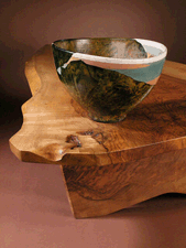 Turquoise Inlet Wayne Higby 1983 Rakufired earthenware atop an English walnut Slab Coffee Table by George Nakashima 1960