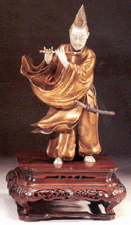 Okimono in gold lacquer and carved ivory of Fujiwara no Yasumasa Japan Meiji Period Flying Cranes Antiques Ltd New York City