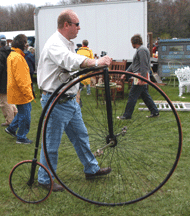 Bike collector David Toppin of Holden Mass found himself a nice high wheel bike Brimfield Acres North